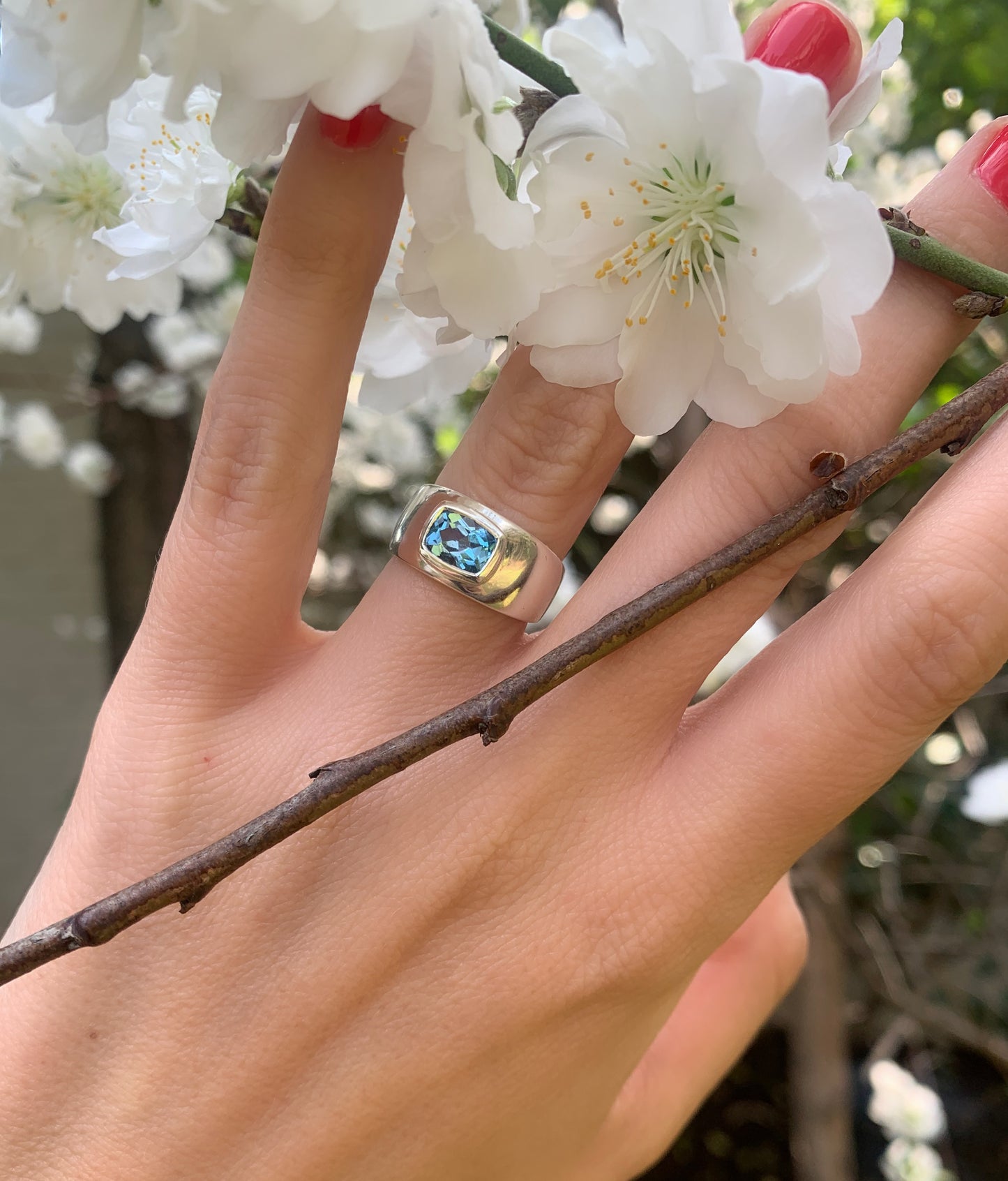 Silver dome ring with blue topaz