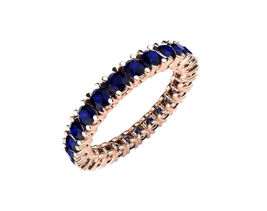 Gold and sapphire eternity ring