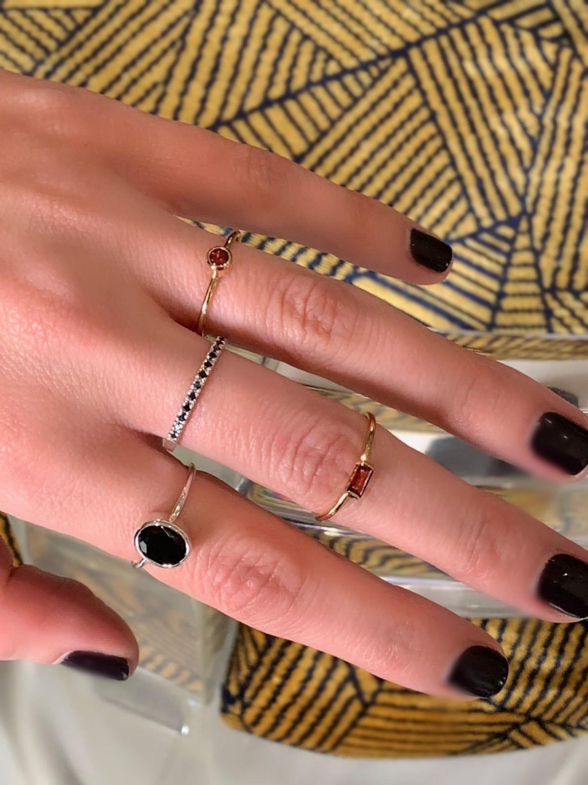 Fine gold stack rings with red garnet